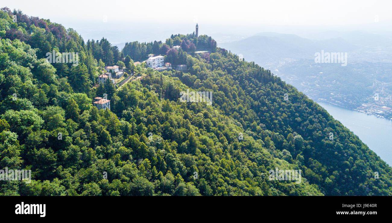 Aerial view of the Voltiano Lighthouse of Brunate and Como lake, trees and green. Lombardy, Italy. Dedicated to Alessandro Volta Stock Photo