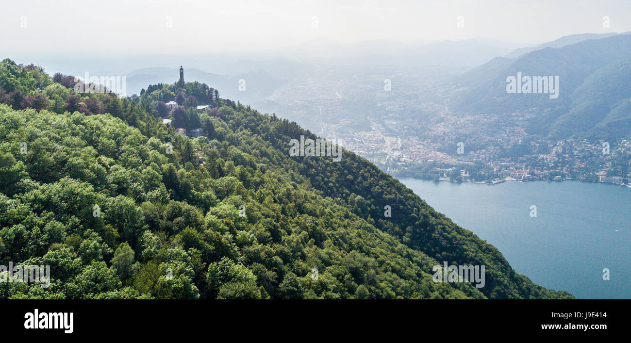 Aerial view of the Voltiano Lighthouse of Brunate and Como lake, trees and green. Lombardy, Italy. Dedicated to Alessandro Volta Stock Photo