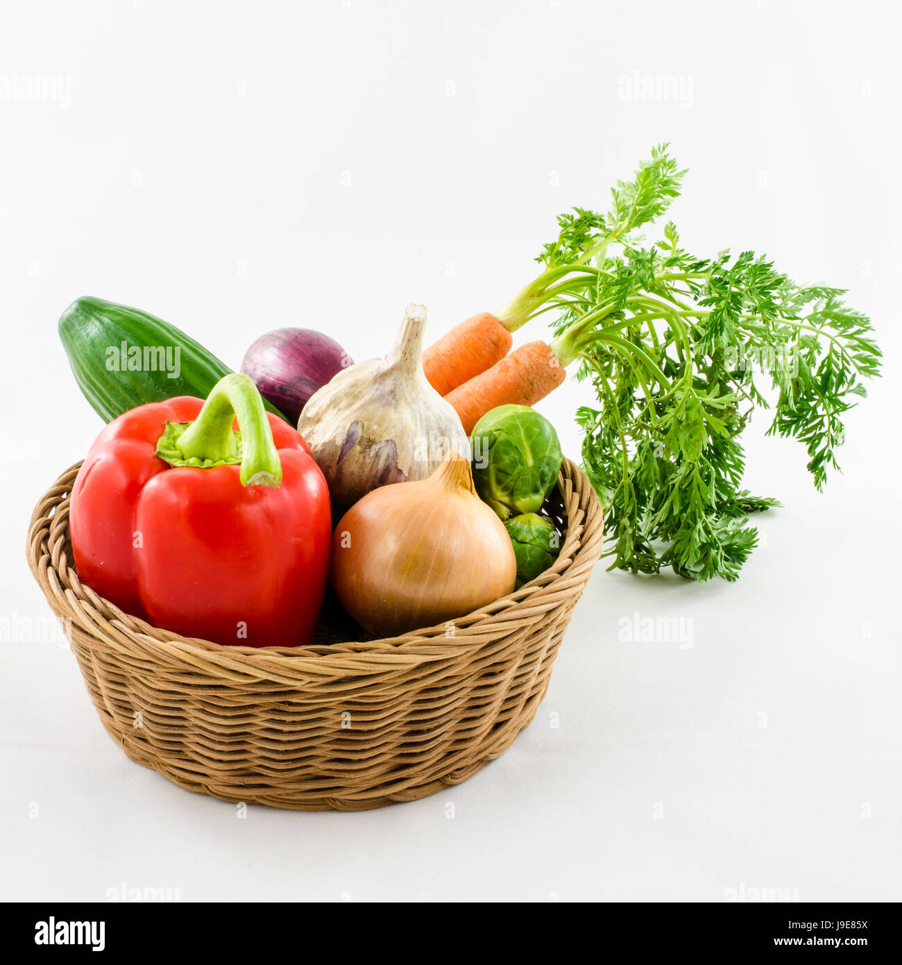 Fresh vegetables in wicker basket Stock Photo - Alamy