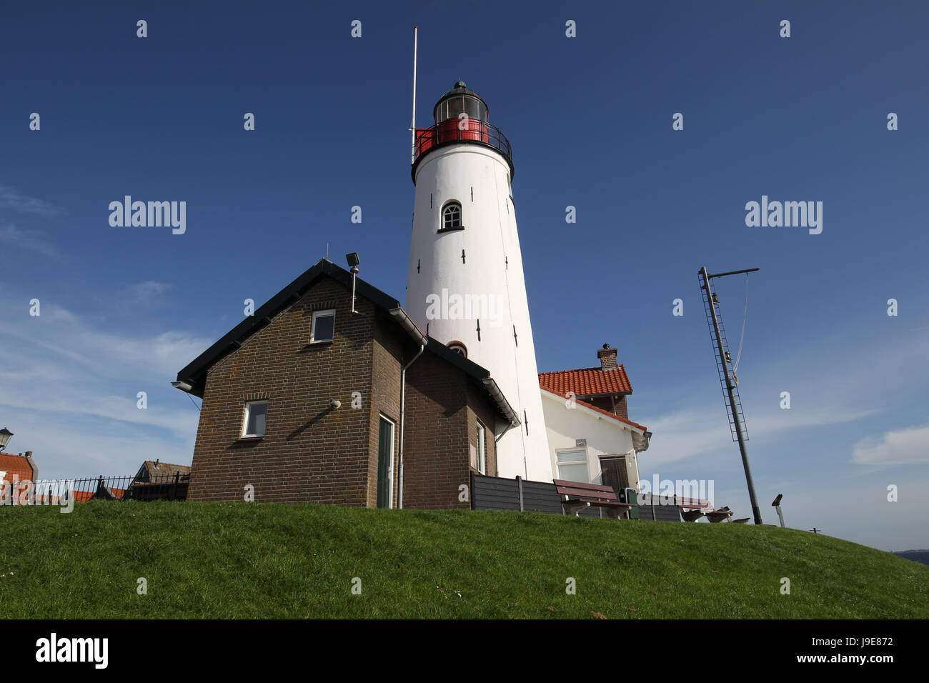 Urk Lighthouse is a lighthouse in Urk, the Netherlands, at the eastern banks of the IJsselmeer. Stock Photo