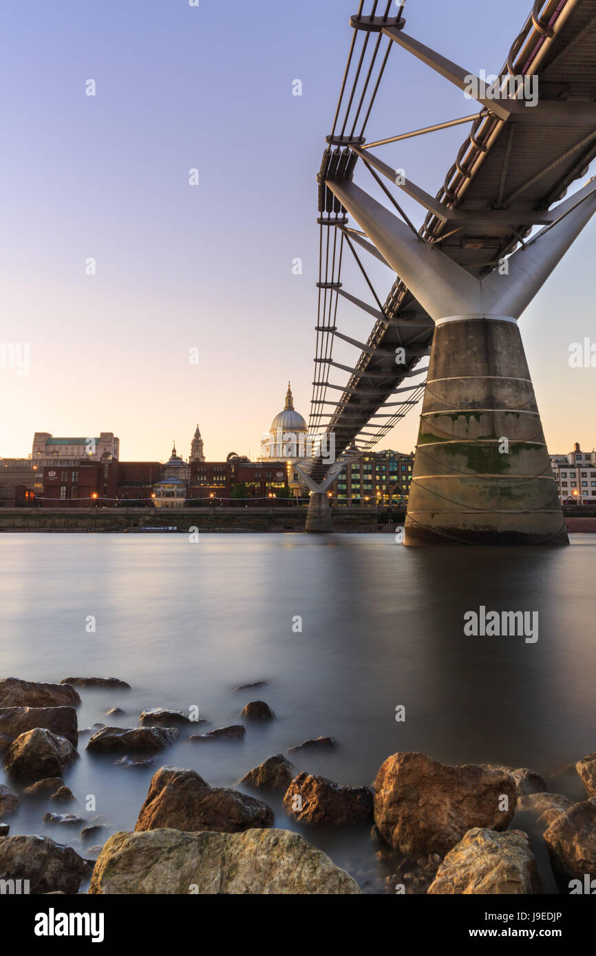 London sunset - view across the River Thames, Millennium Bridge and St Paul's Cathedral Stock Photo