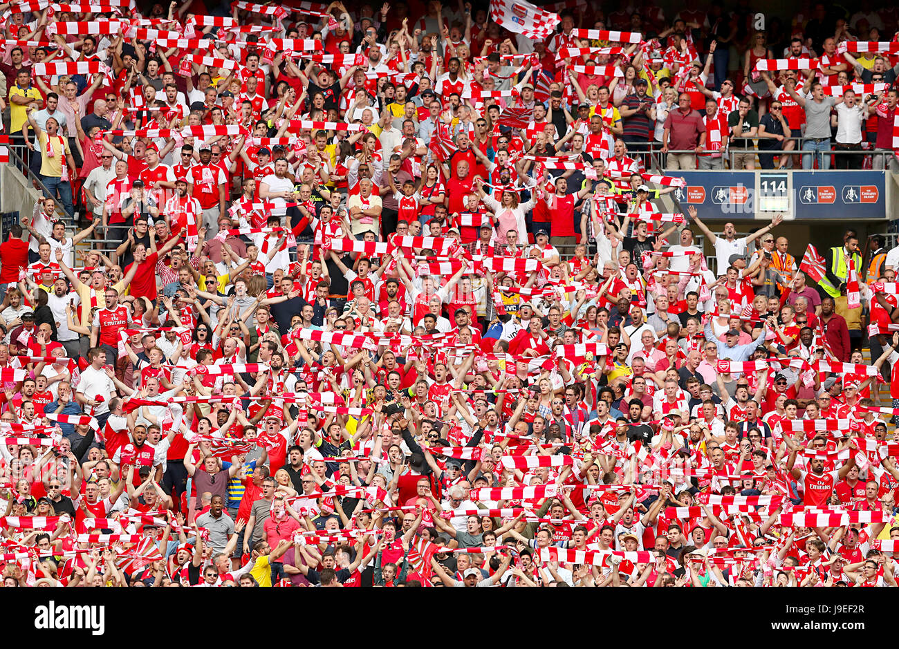 Arsenal fans in the stands Stock Photo Alamy