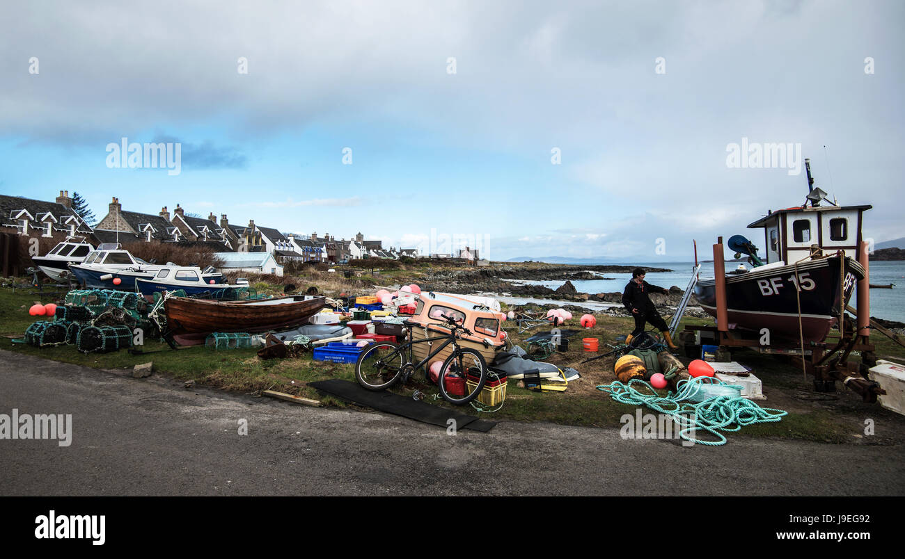 All shipshape all over the place,busy harbour scene Isle of Iona working away getting ready for the start of the season in this heavenly place Stock Photo