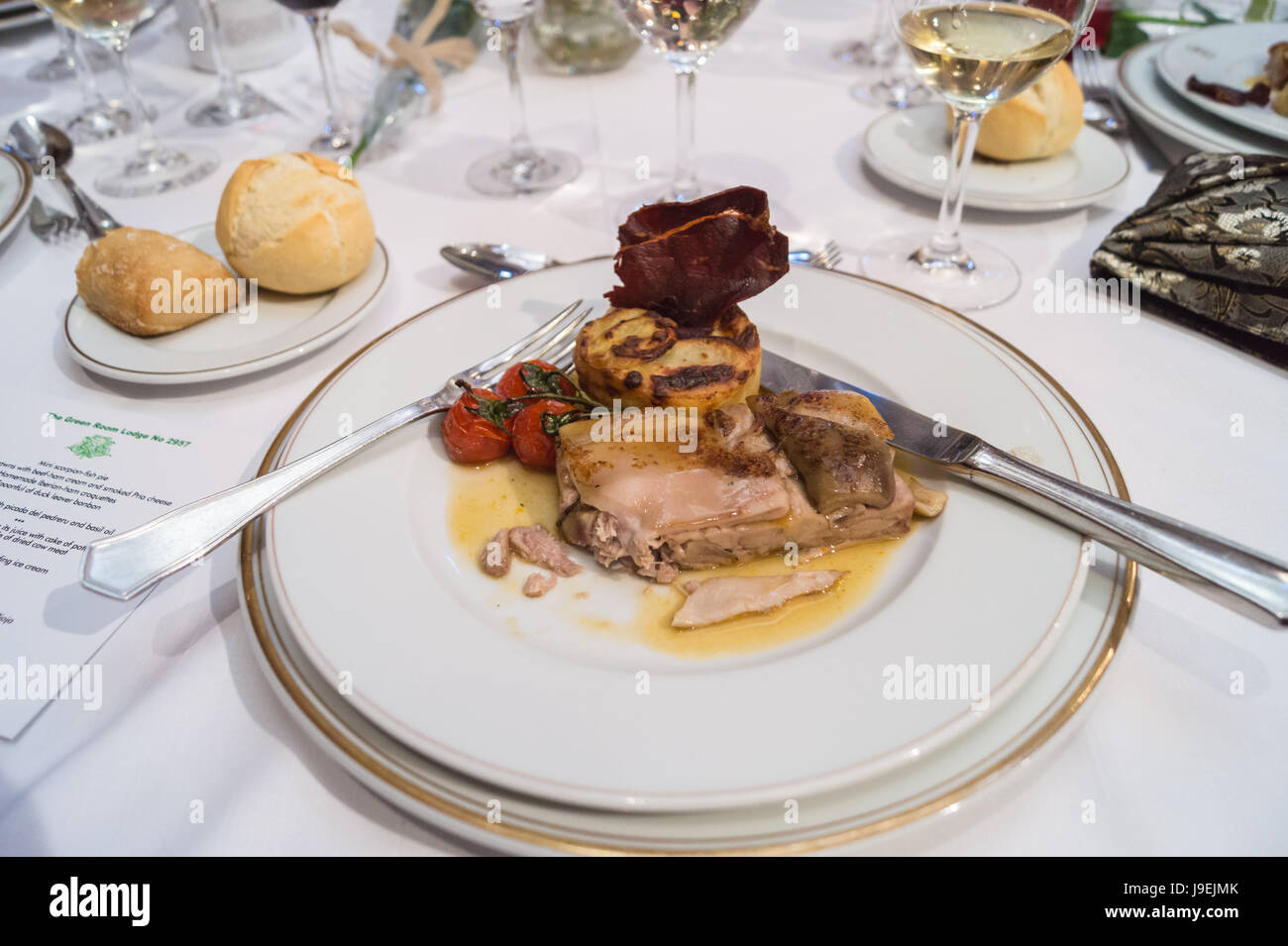 Suckling pig terrine, dauphinoise potato, tomato and crisped beef at a masonic banquet, Eurostars Hotel de la Reconquista, Oviedo Asturias Spain Stock Photo