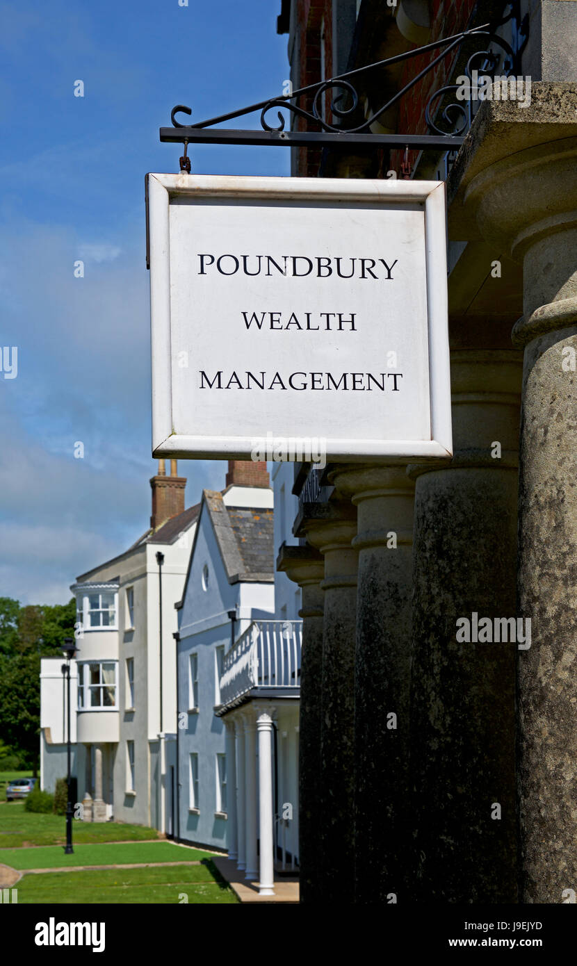 Sign for wealth management company, Poundbury, Dorset, England UK Stock Photo