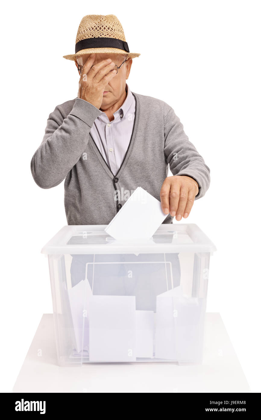 Senior voting and holding his head in disbelief isolated on white background Stock Photo