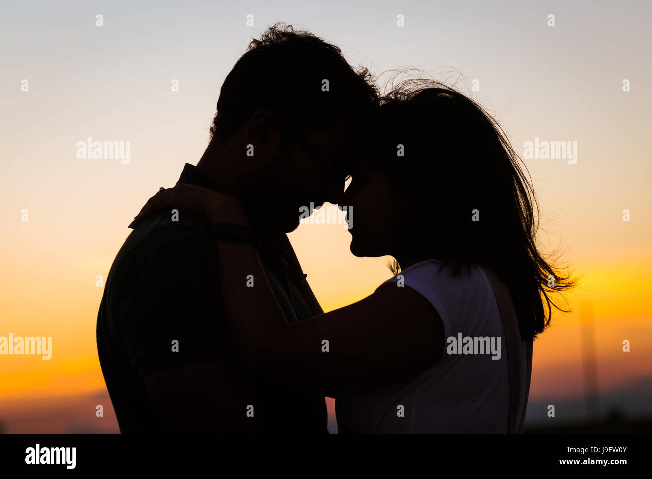 Romantic Couple silhouette on a calm evening Stock Photo