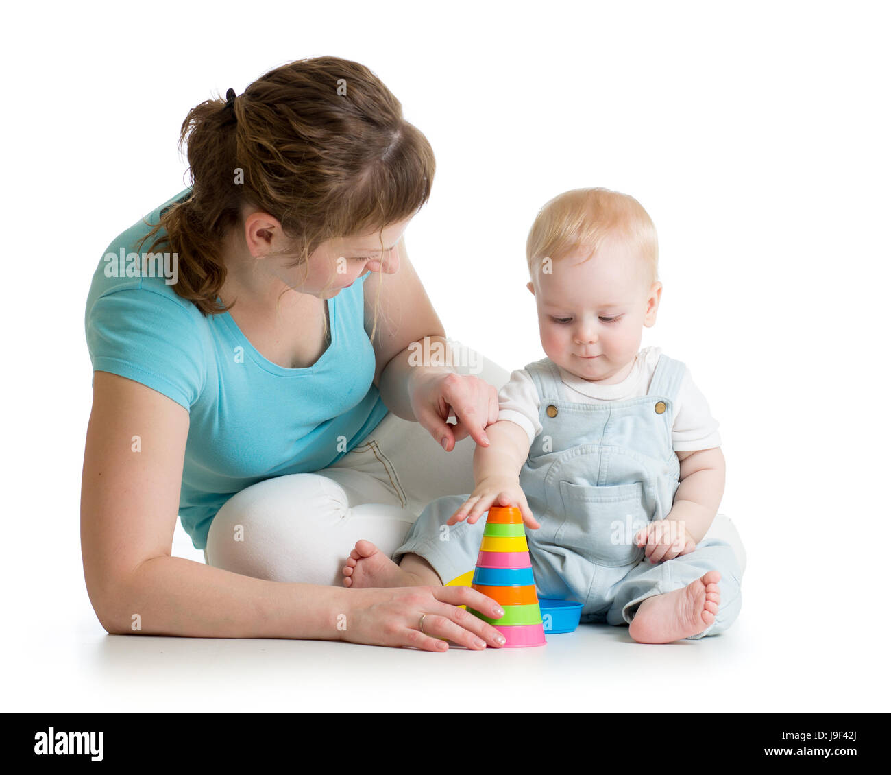 child and mom play with block toys Stock Photo