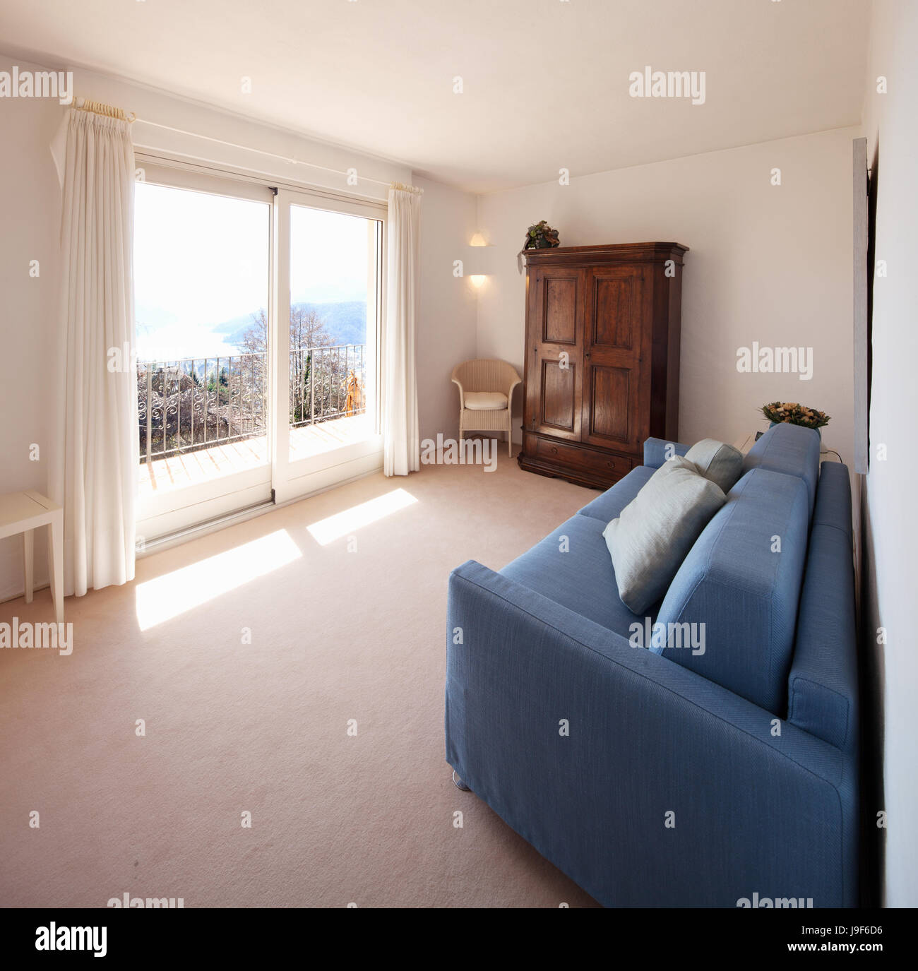 Small white room with beautiful landscape of Lugano Stock Photo