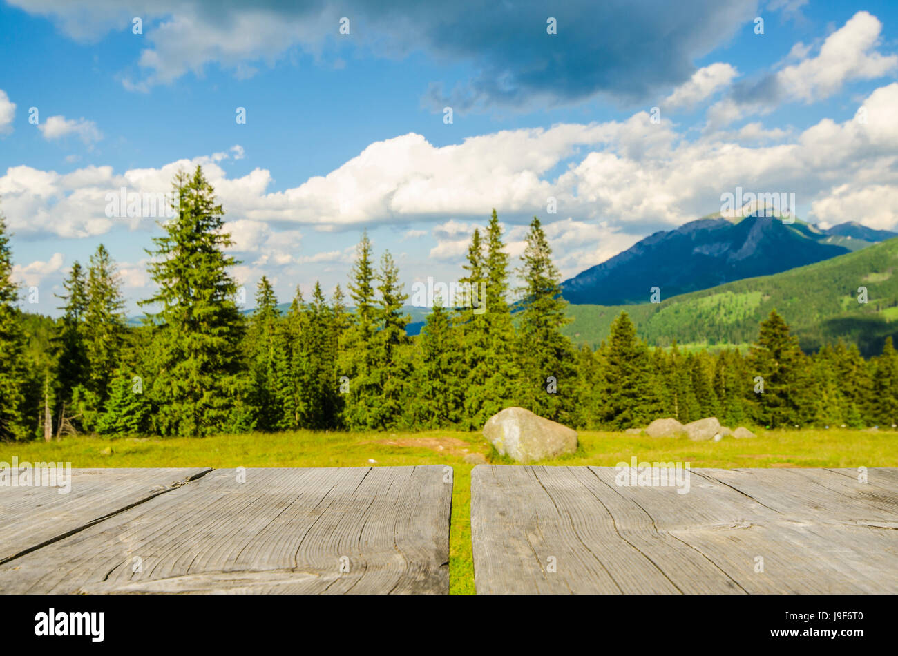 Empty table with landscape background Stock Photo - Alamy
