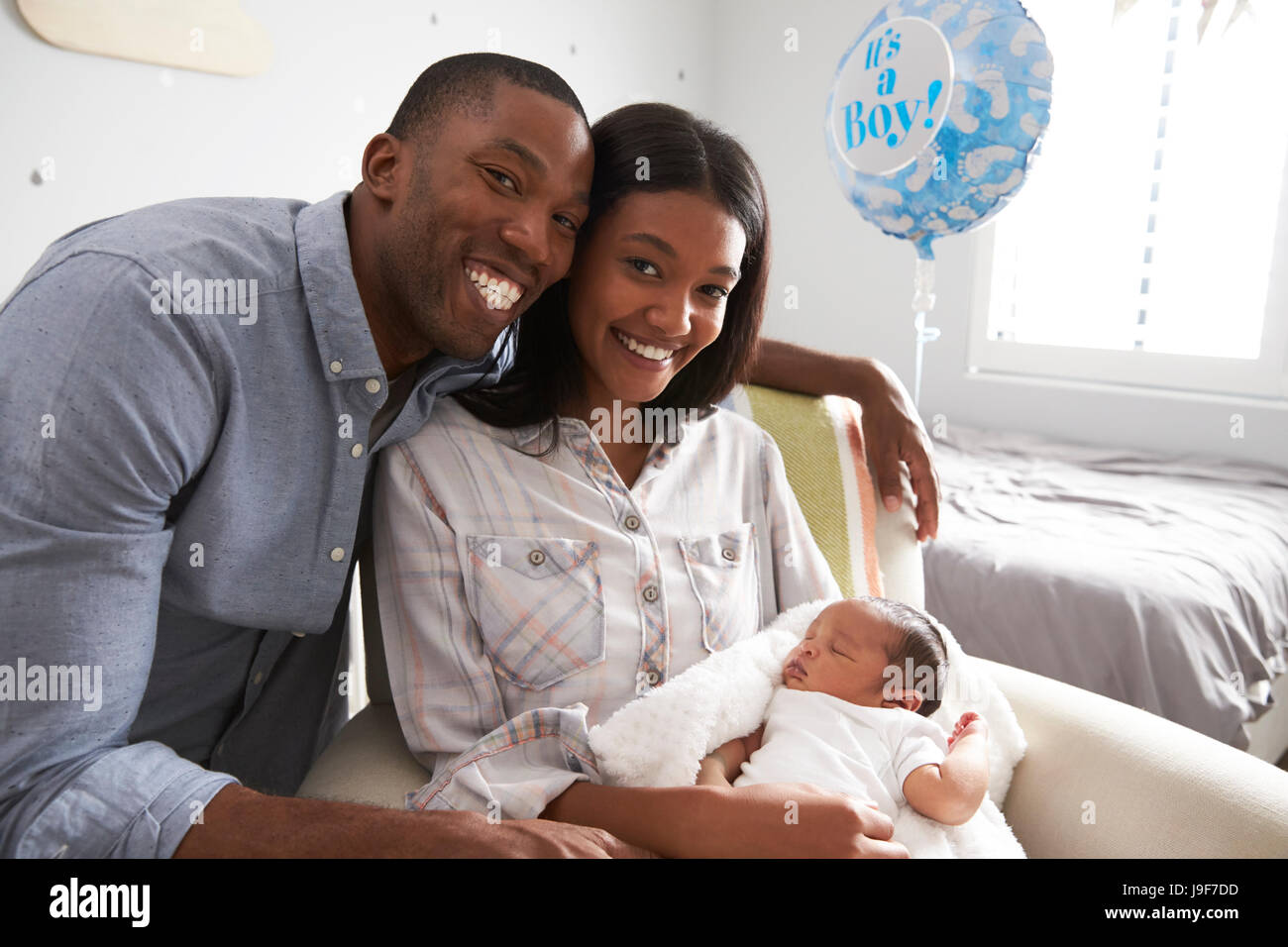 Portrait Of Parents Home from Hospital With Newborn Baby Stock Photo