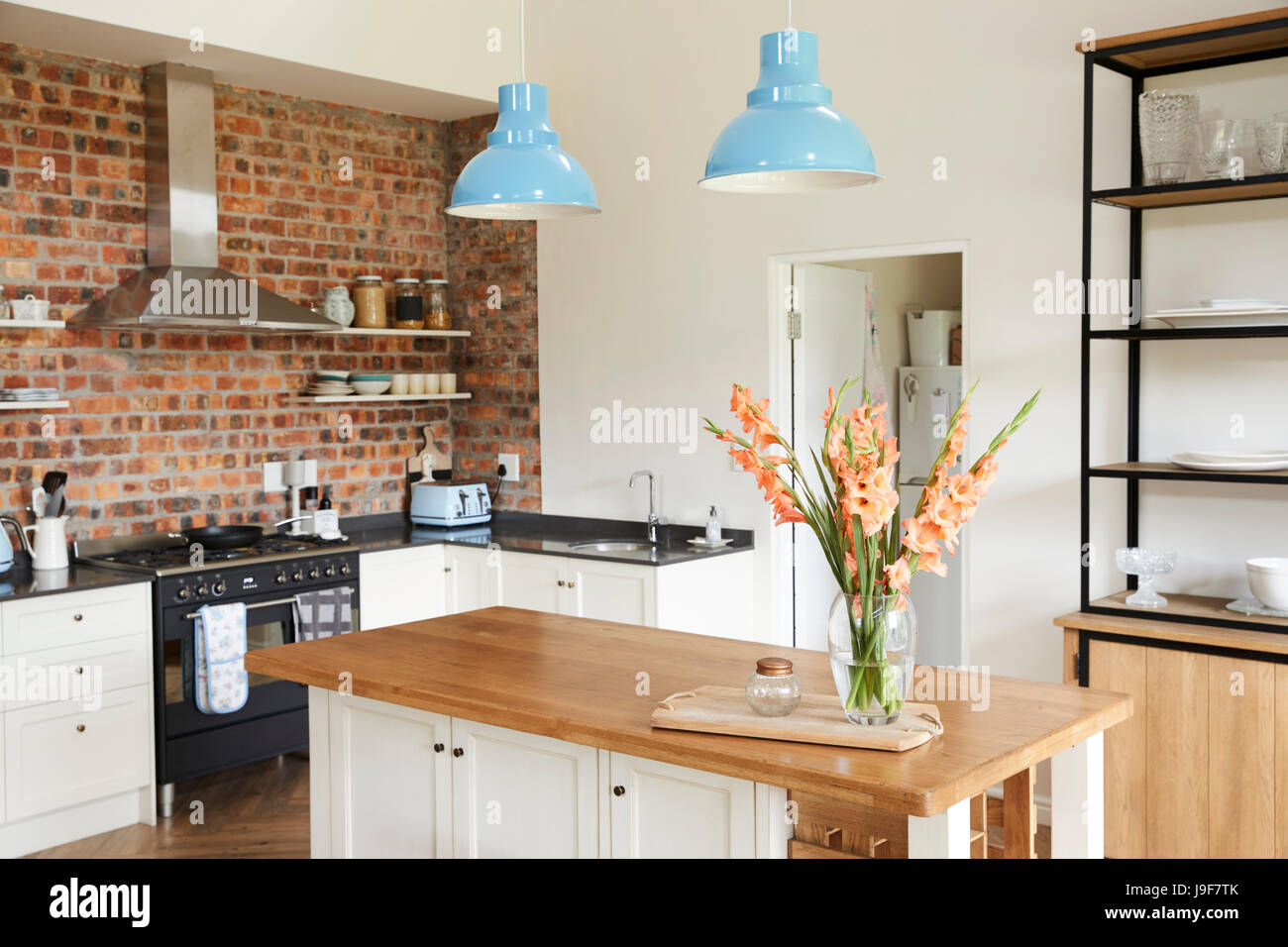 Home Interior With Open Plan Kitchen, Lounge And Dining Area Stock