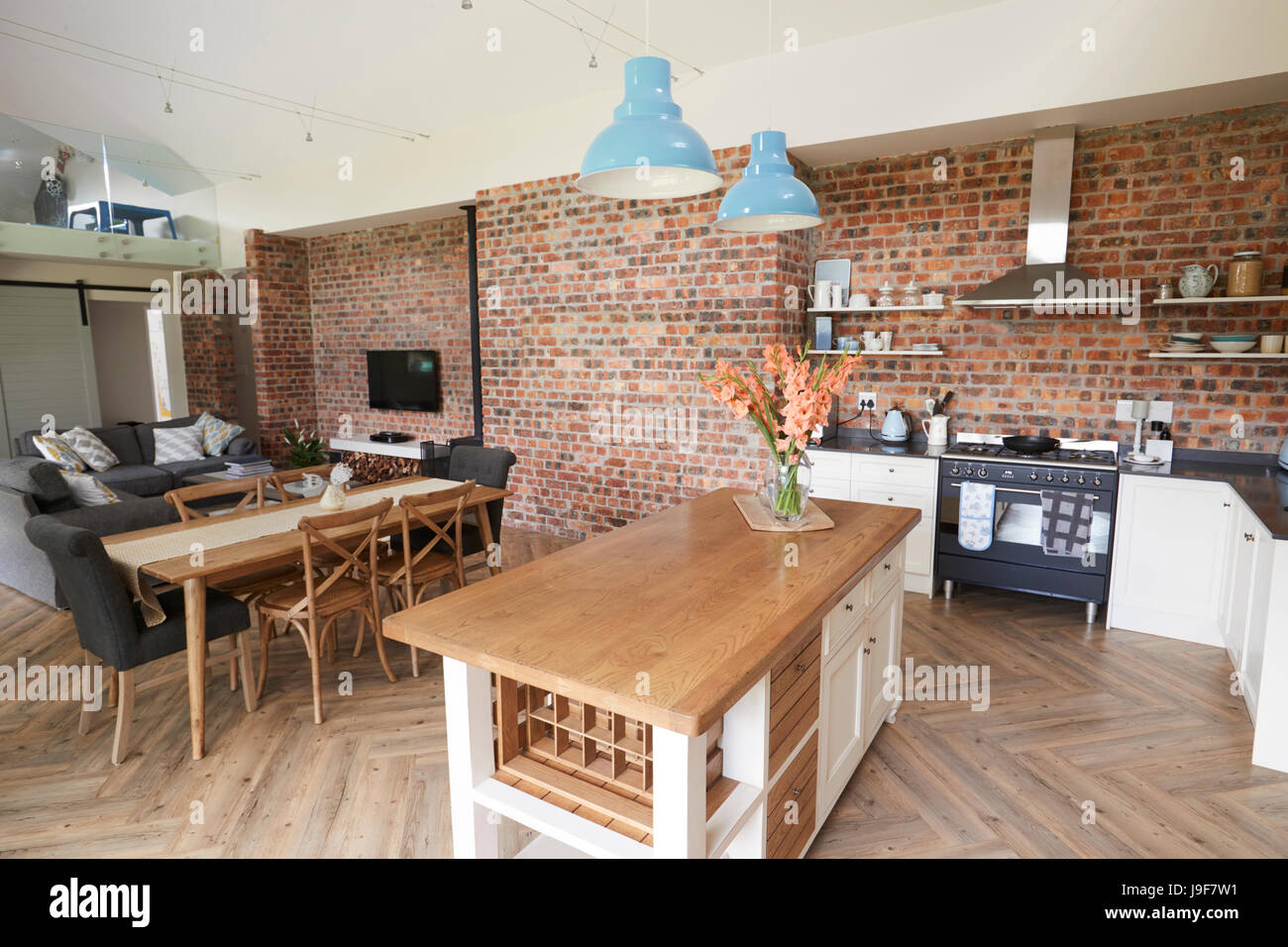 Home Interior With Open Plan Kitchen, Lounge And Dining Area Stock