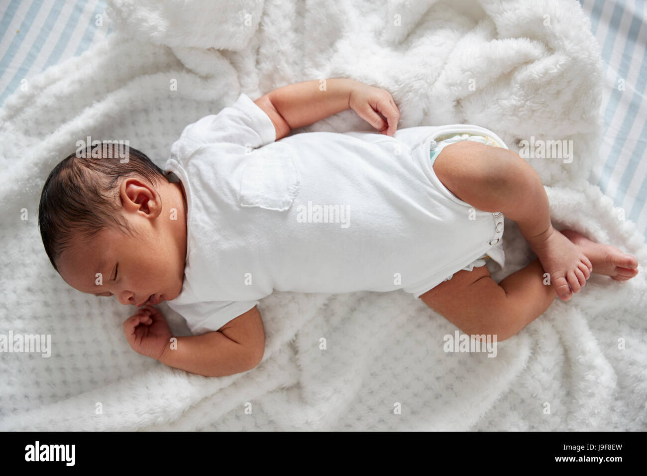 Newborn Baby Sleeping In Nursery Cot Stock Photo Alamy