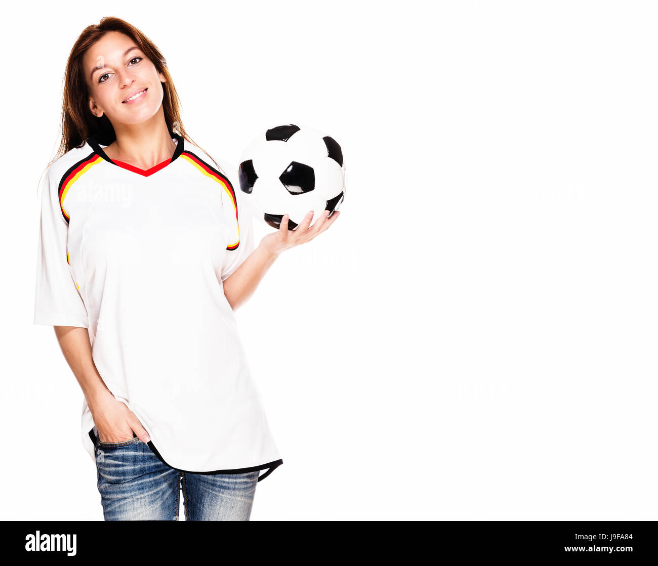 young laughing woman wearing jersey and holding football Stock Photo