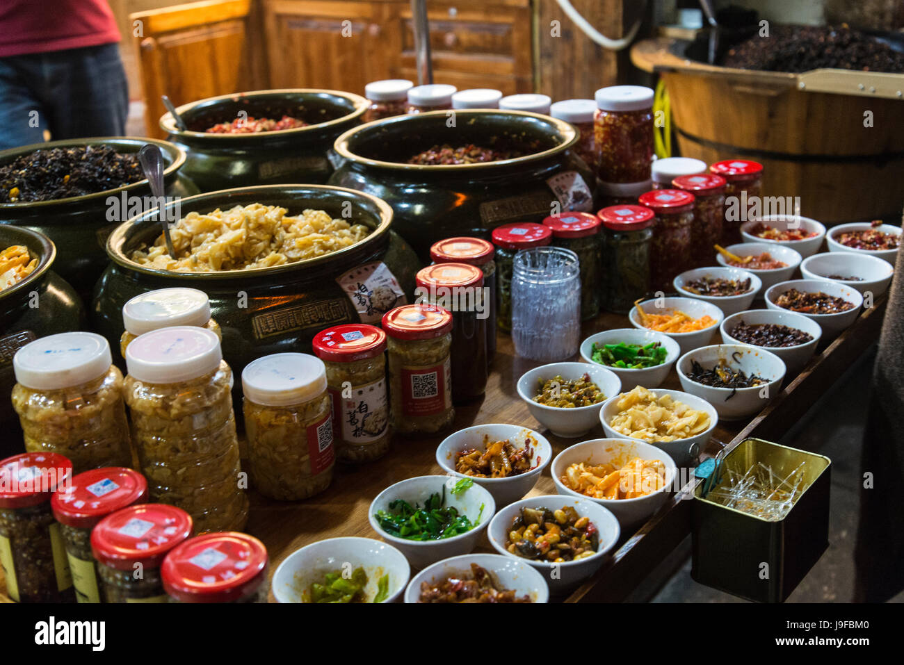 Local food delicacies sold in the street,  Tunxi Old Street, traditional shopping hub, Huangshan, Anhui province, China Stock Photo