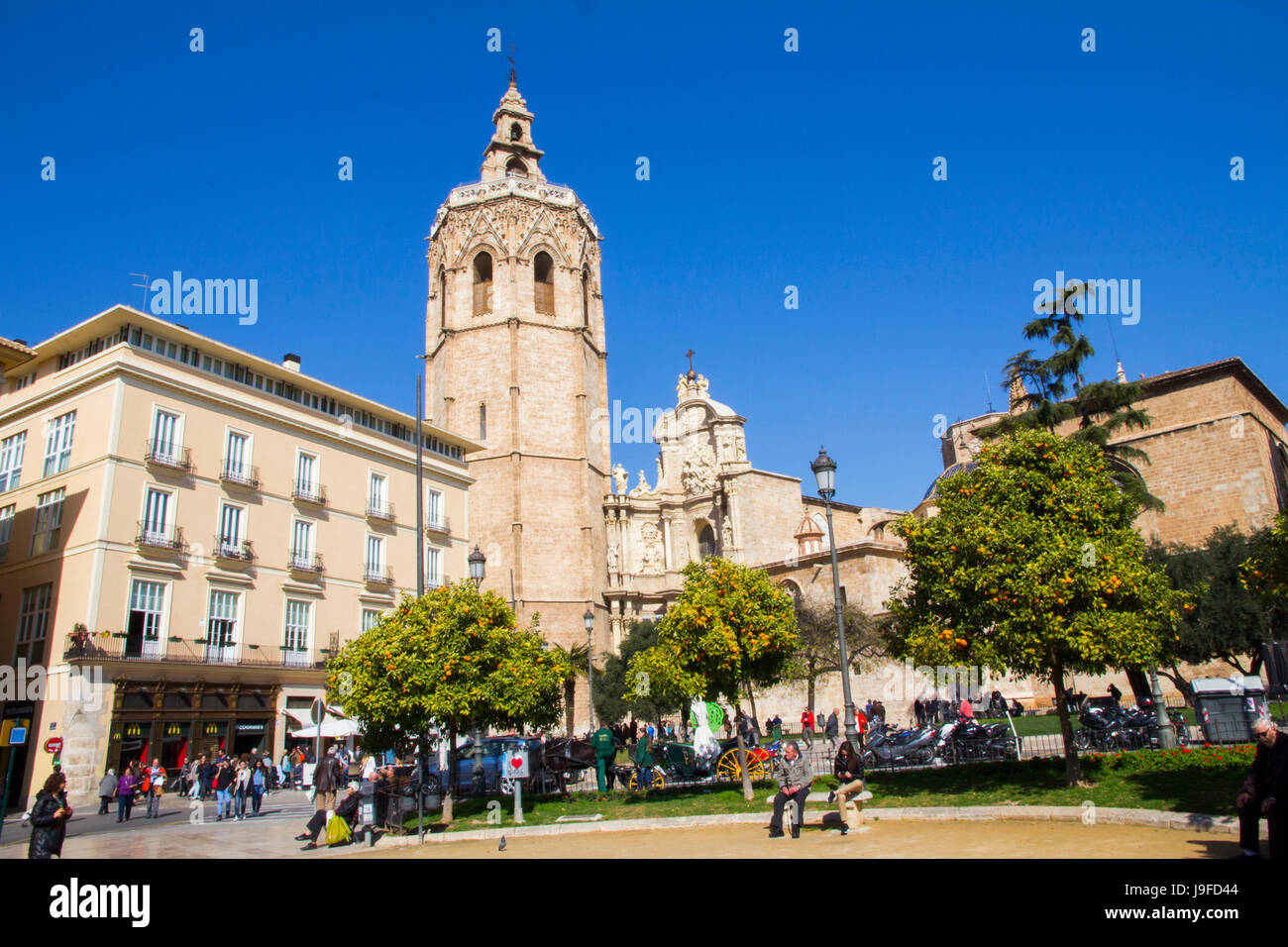Viewed from Plaza de la Reina, the Gothic-style Bell tower or Micalet, fronts the Valencia Cathedral, Valencia, Spain. Stock Photo