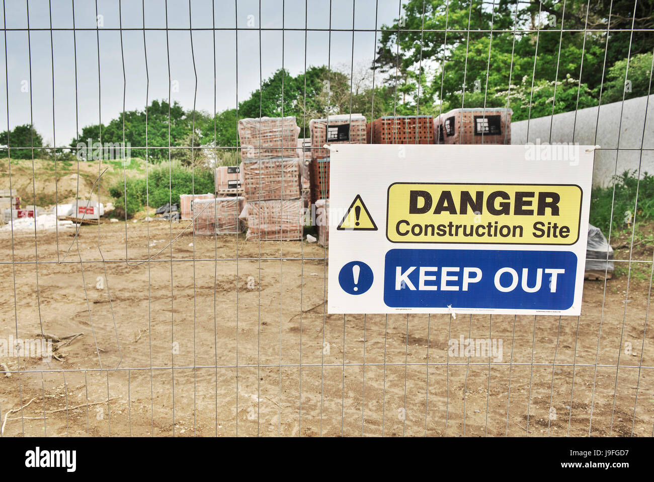 Danger, Construction site signage at a new home building site in Norfolk, UK Stock Photo