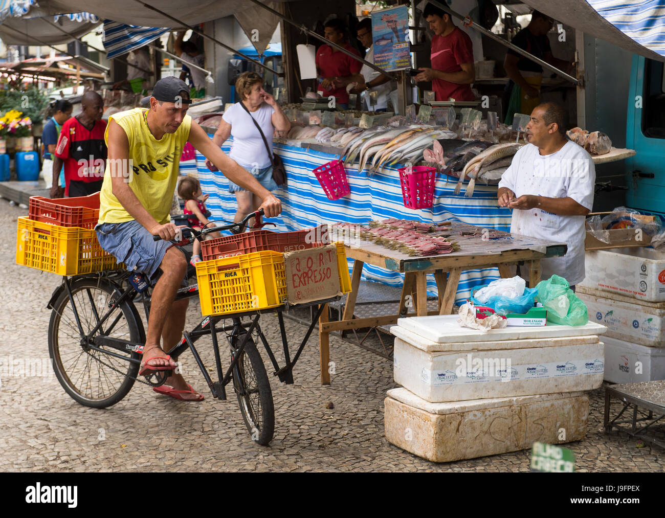 RIO DE JANEIRO - JANUARY 31, 2017: Customers shop at the fish market, an outdoor stall in the weekly farmers market in Ipanema. Stock Photo