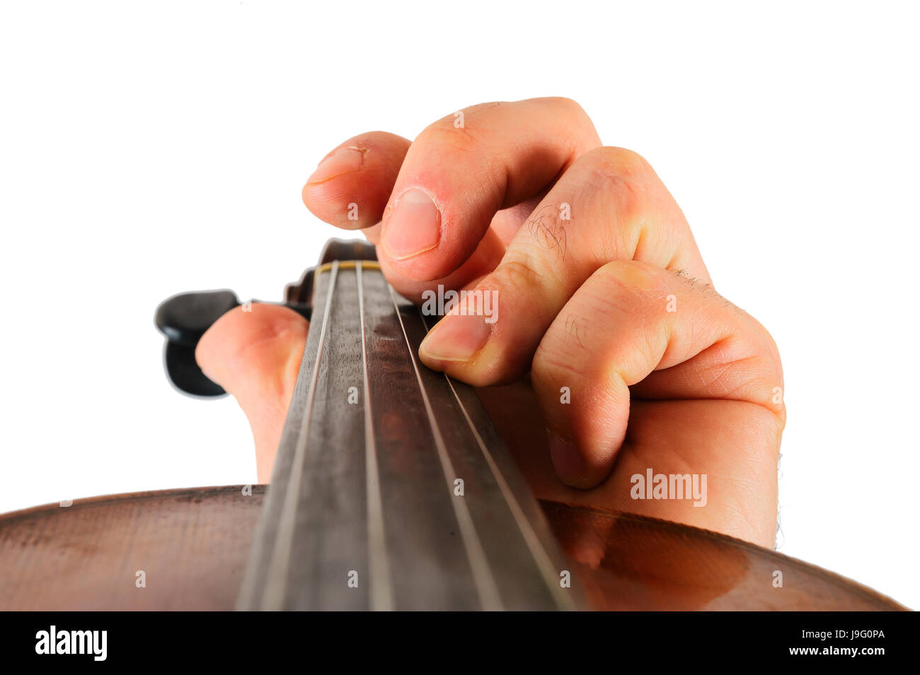 Image violin lies in a human hand.String instrument isolated on white