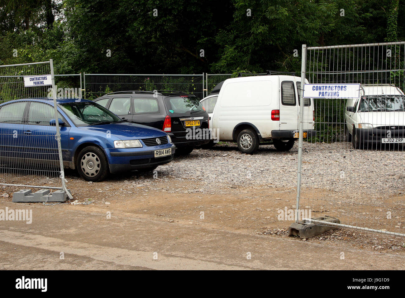 Temporary car park with fencing on a construction site Stock Photo