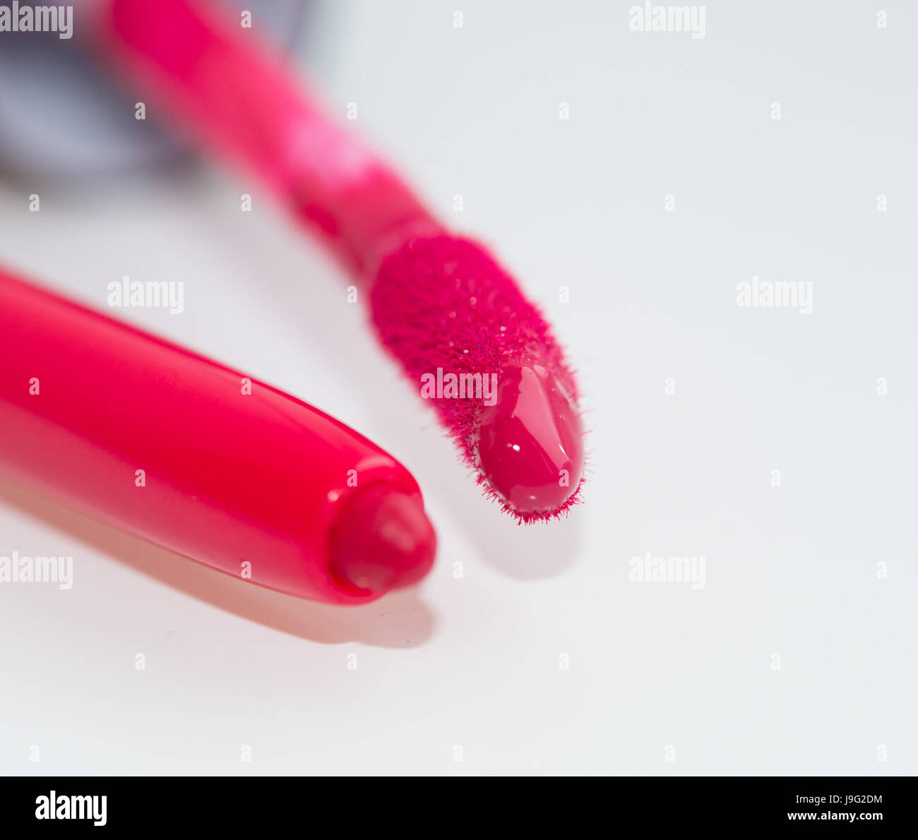 Hot pink lip gloss and lip liner close-up Stock Photo