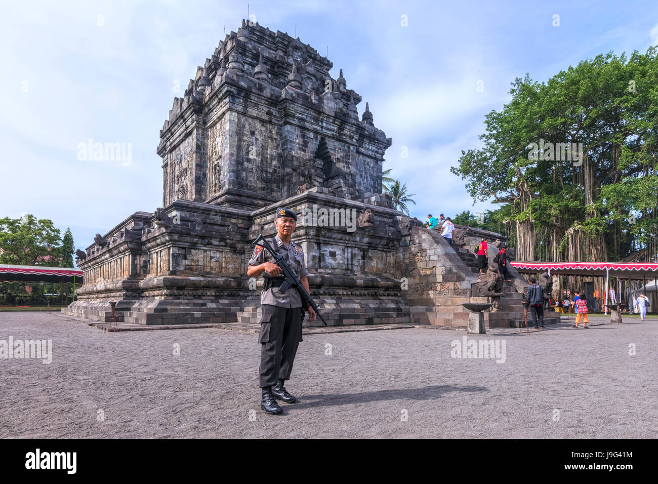 guard protecting Mendut Temple, Borobudur, Java, Indonesia, Asia Stock Photo