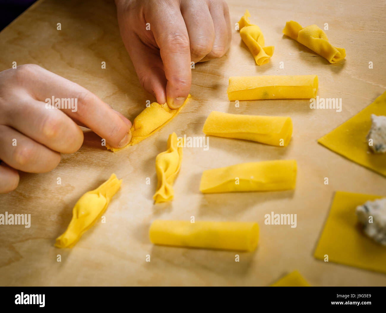 Preparing hand made fresh stuffed pasta shaped like a candy Stock Photo