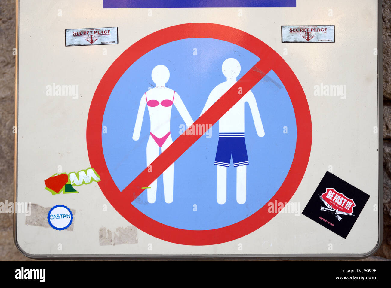 Road Sign Forbidding the Wearing of Bathing Suits, Trunks or Bikinis in the Town Centre of Aigues-Mortes Camargue France Stock Photo