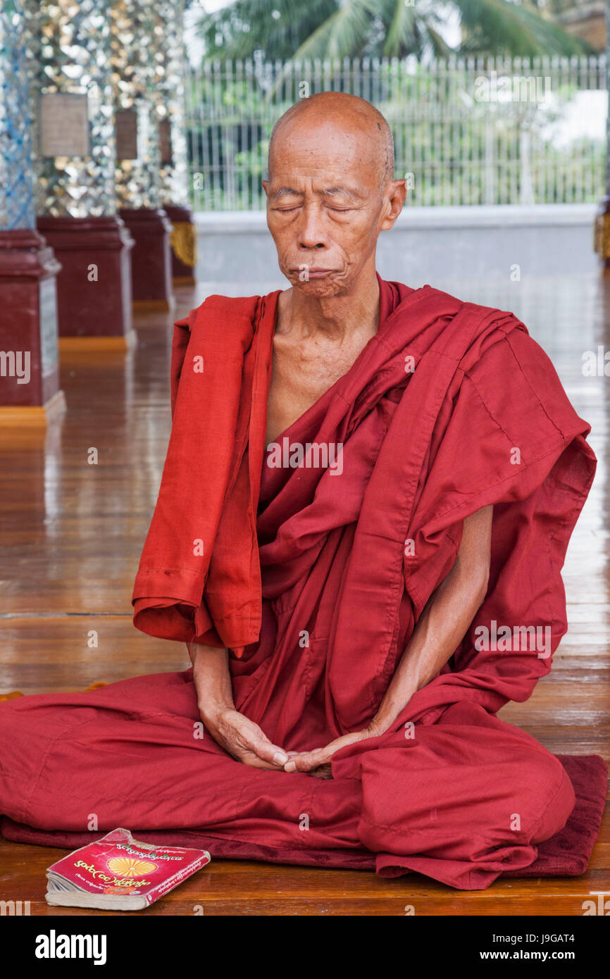 Myanmar, Yangon, Shwedagon Pagoda, Monk Meditating Stock Photo