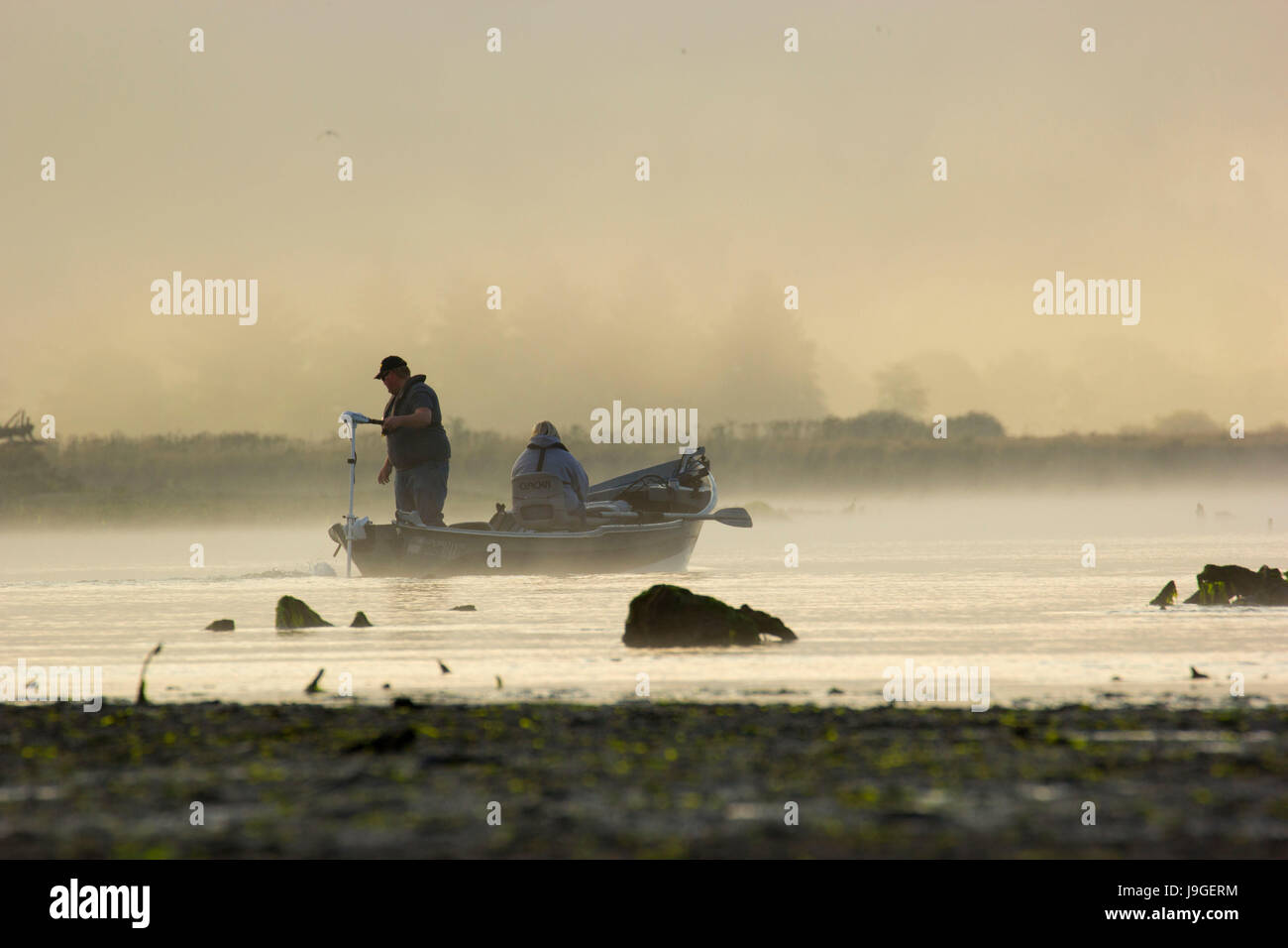 Driftboat on Salmon River estuary with fog, Cascade Head Scenic
