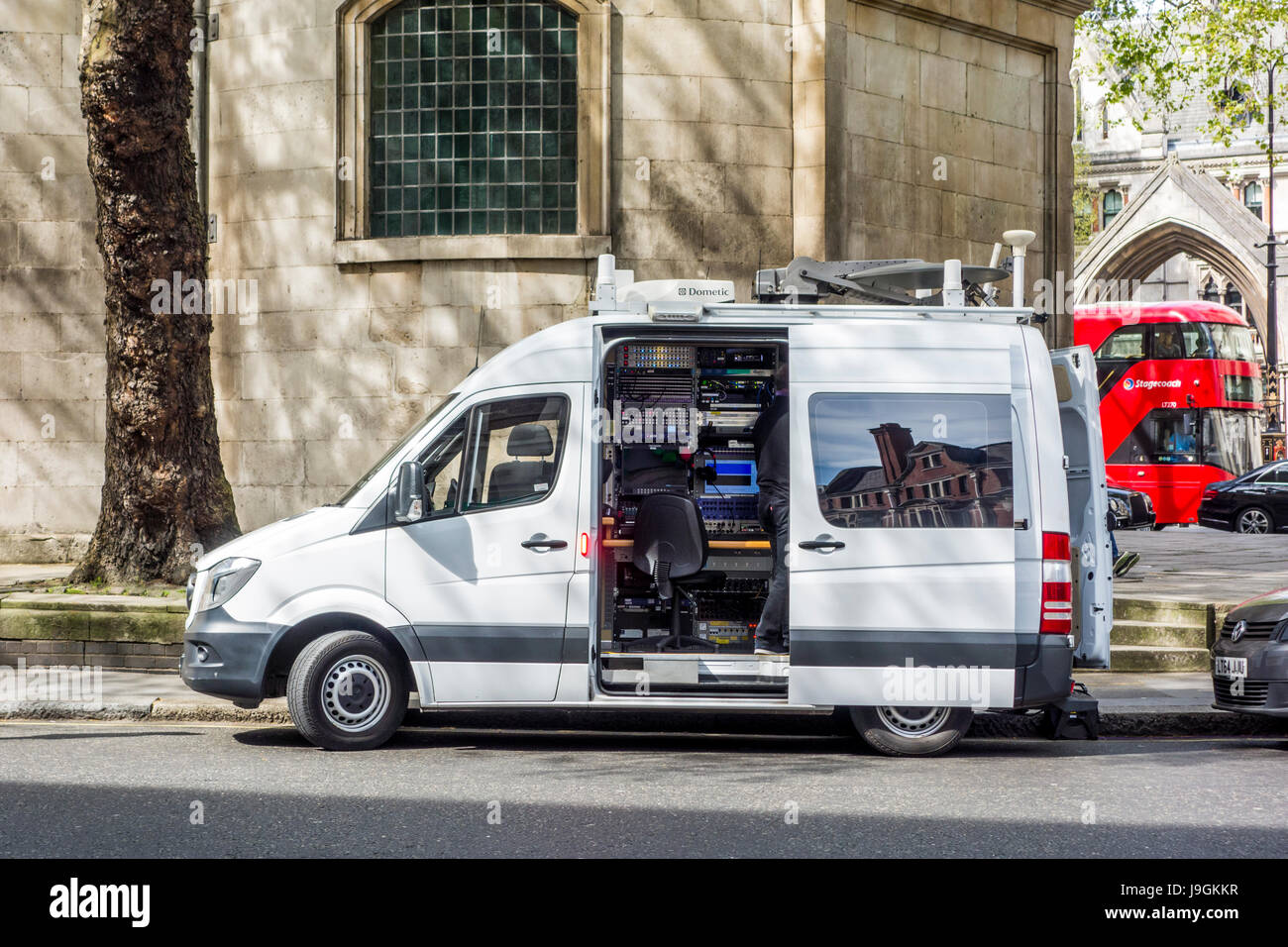 Television (TV) outside broadcast (OB) vans outside Royal Courts of Justice, London, UK Stock Photo