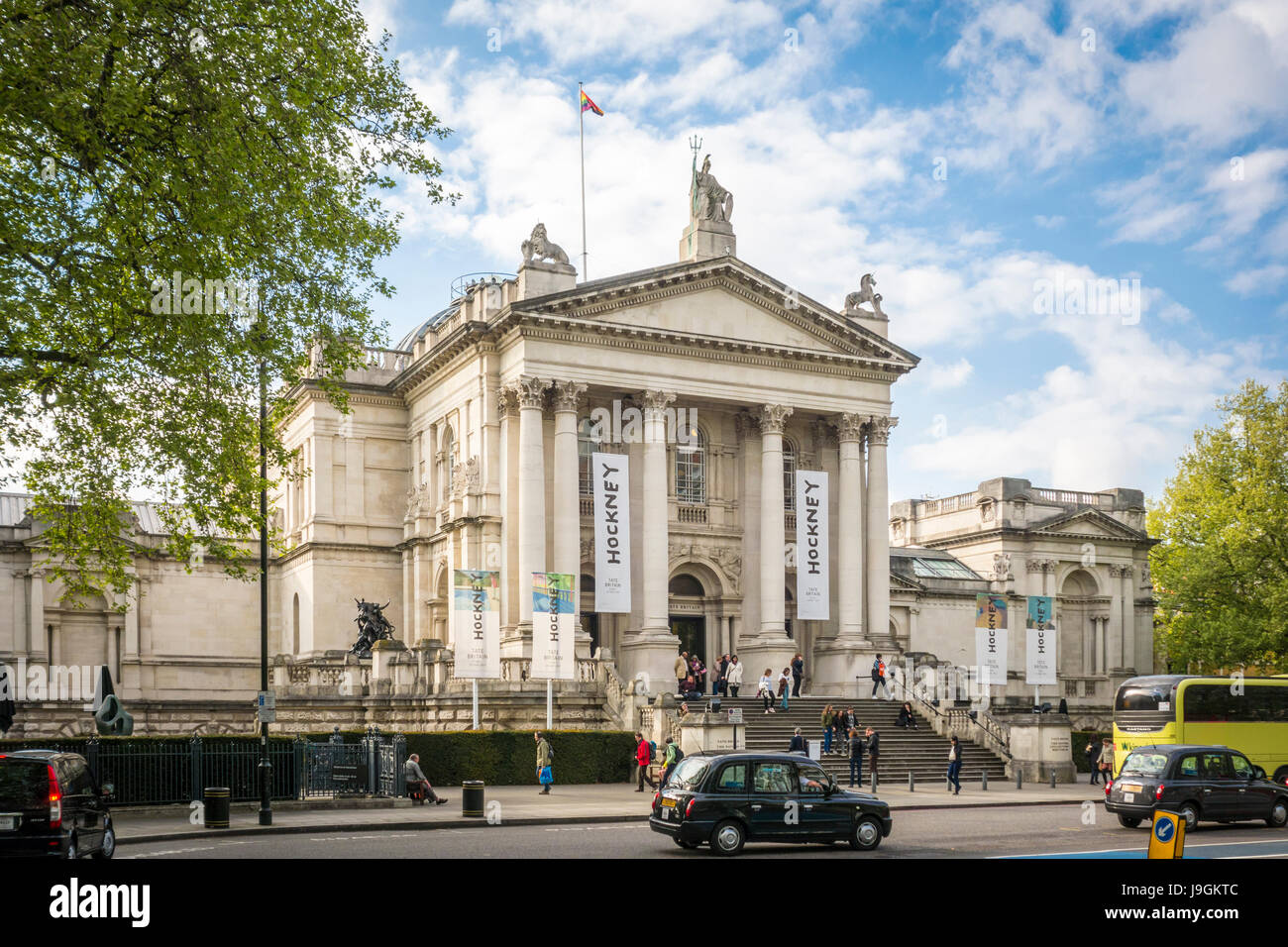 Banners for the Hockney exhibition outside Tate Britain viewed from Millbank, London, UK Stock Photo