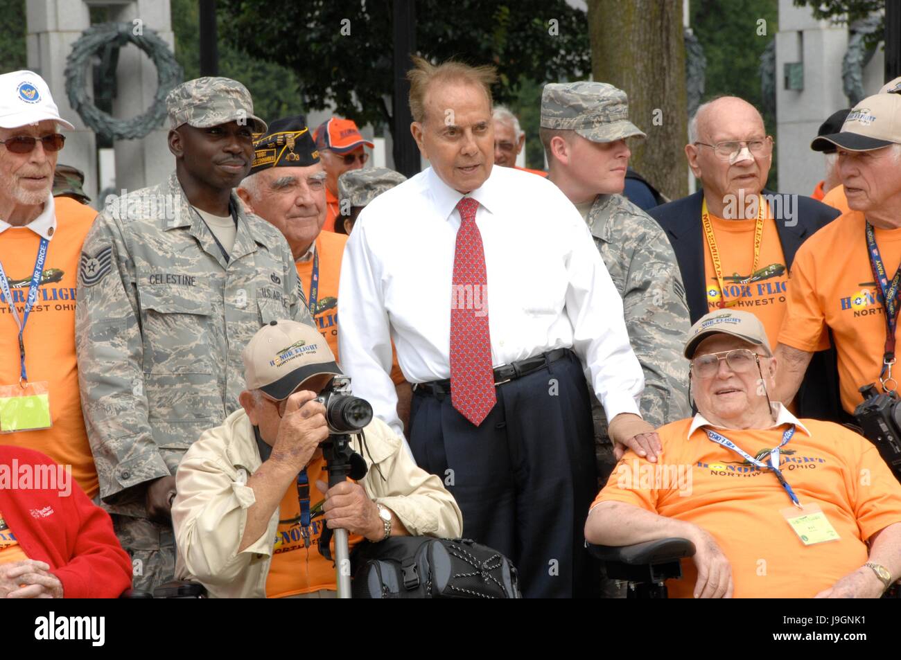 Former U.S. Senator and veteran Bob Dole, center, poses for a group photo with World War II veterans from the Northwest Ohio division of the 2009 Honor Flight World War II Memorial Tour September 16, 2009 in Washington, DC. Honor Flight is a volunteer program that brings veterans to Washington to visit the World War II memorial. Stock Photo