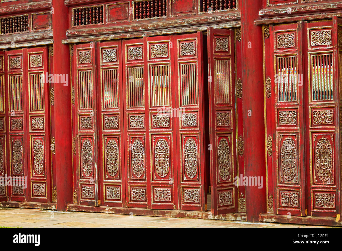 Red doors in the Forbidden Purple City, historic Hue Citadel (Imperial City), Hue, North Central Coast, Vietnam Stock Photo