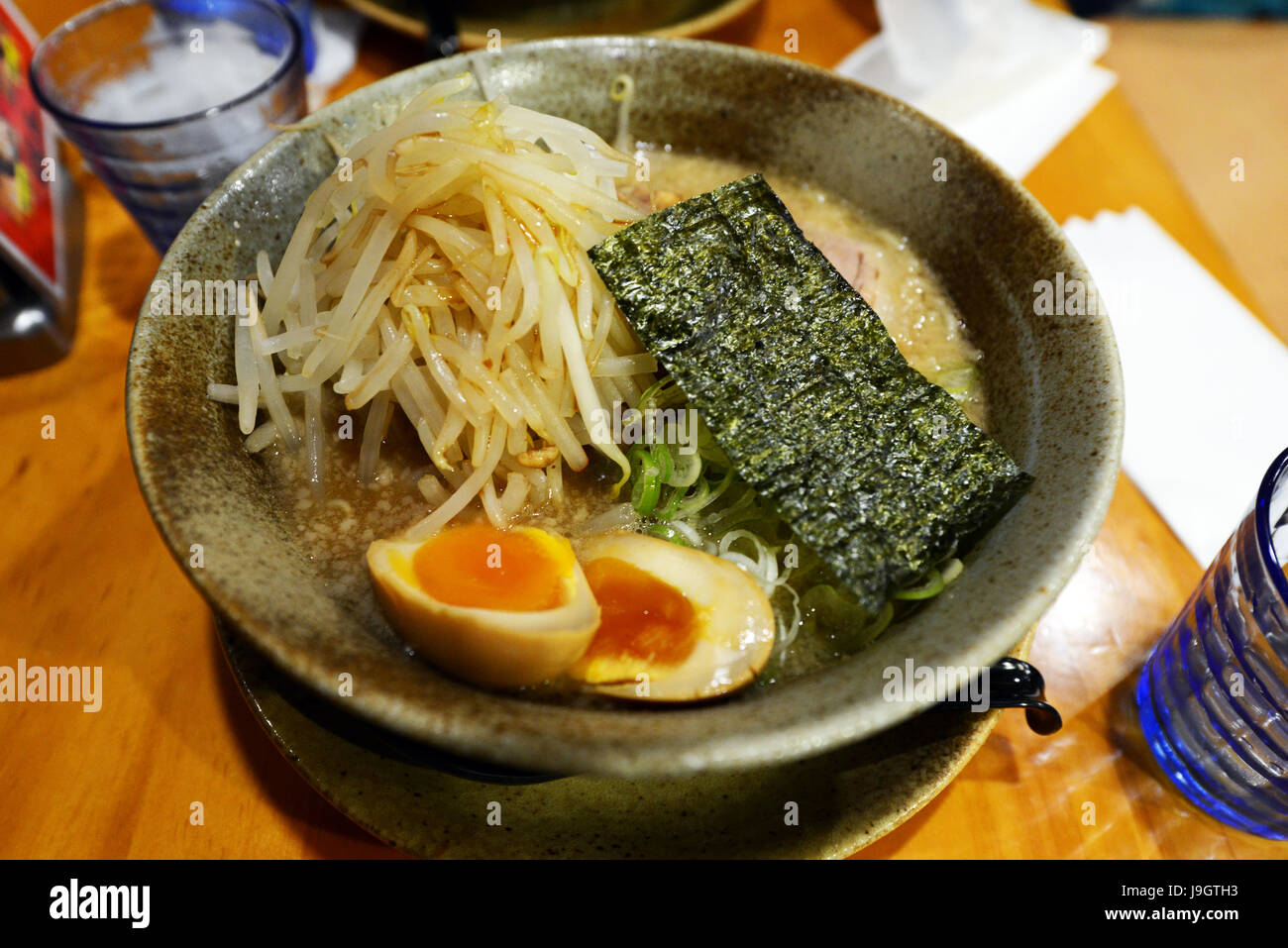 A bowl of Ramenn noodles served in a traditional Ramen restaurant in Shinjuku, Tokyo Stock Photo
