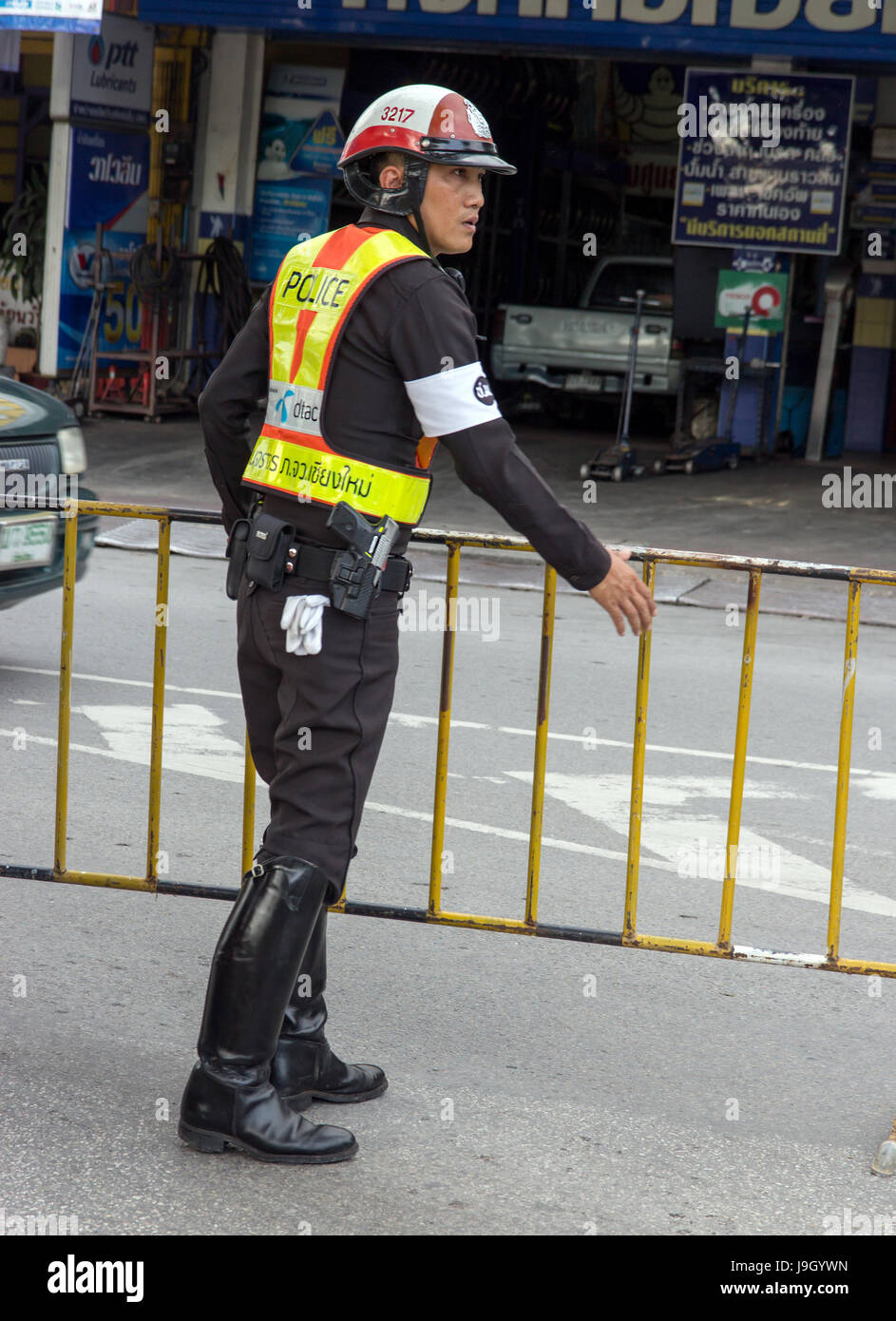 THAILAND, CHIANG MAI, NOV 07 2014, Police officers in the streets of the city builds handrails for traffic restrictions, Stock Photo