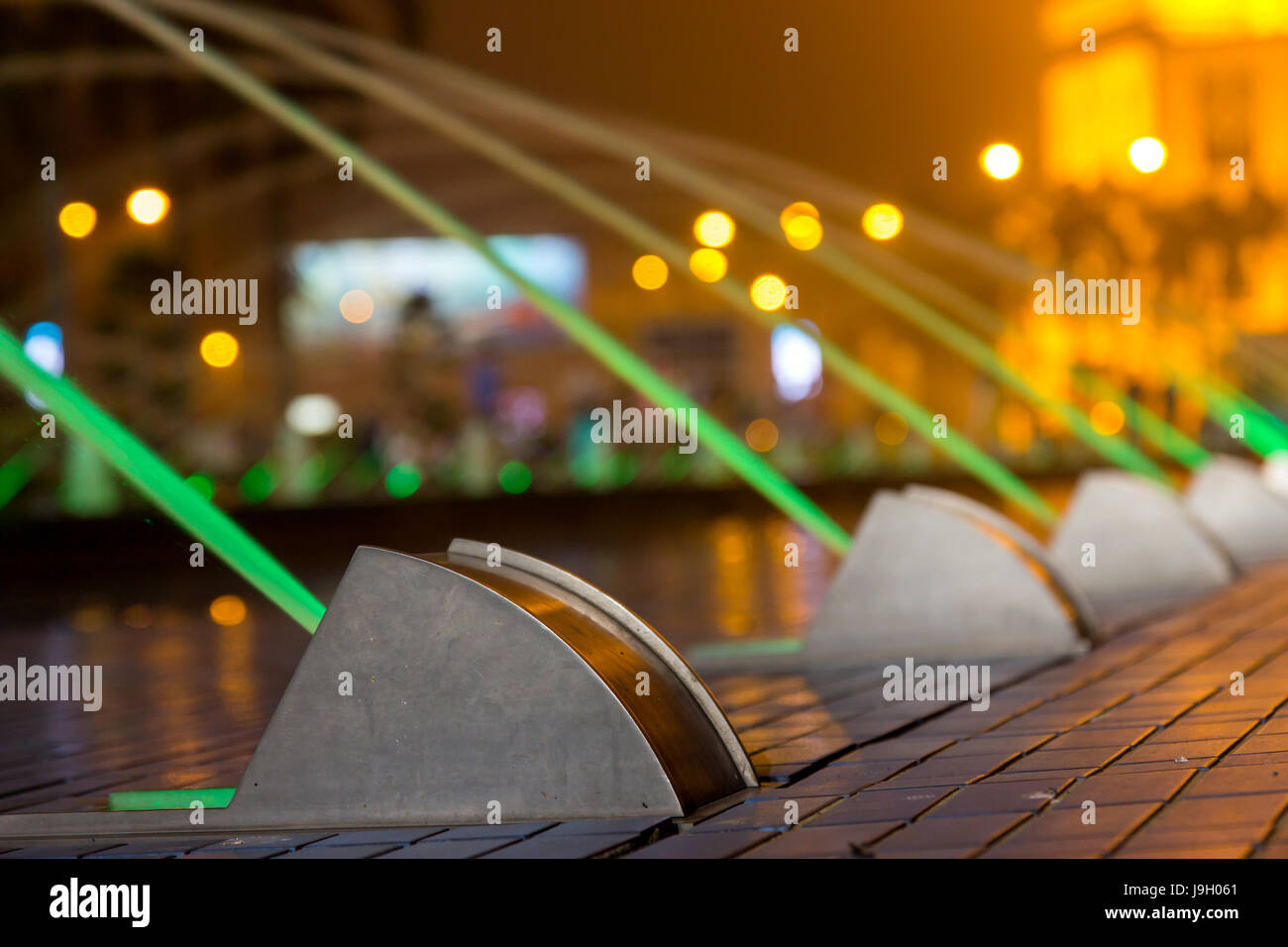 Water fountain in night is illuminated green color Stock Photo - Alamy