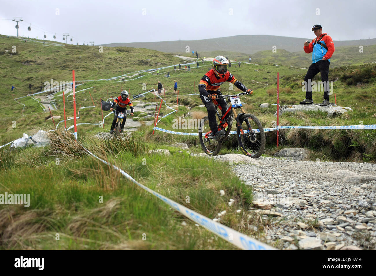 Fort William, Scotland. 2nd June, 2017. Steve Peat watching riders Alex Marin and Matthew Simmonds practicing on the course for Sunday's Downhill World Cup. Malcolm Gallon/Alamy Live News Stock Photo
