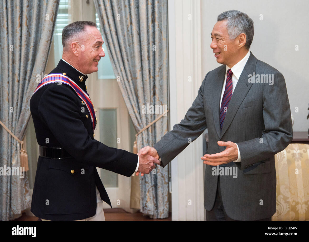 U.S. Chairman of the Joint Chiefs Gen. Joseph Dunford meets with Singapore Prime Minister Lee Hsien Loong at the Istana official residence June 2, 2017 in Singapore. Dunford is in Singapore to attend the Shangri-La Dialogue, an Asia-focused defense summit along with Defense Secretary Jim Mattis. Stock Photo