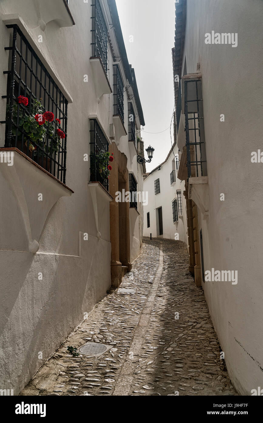 Ronda (Andalucia, Spain) old typical street with white houses Stock