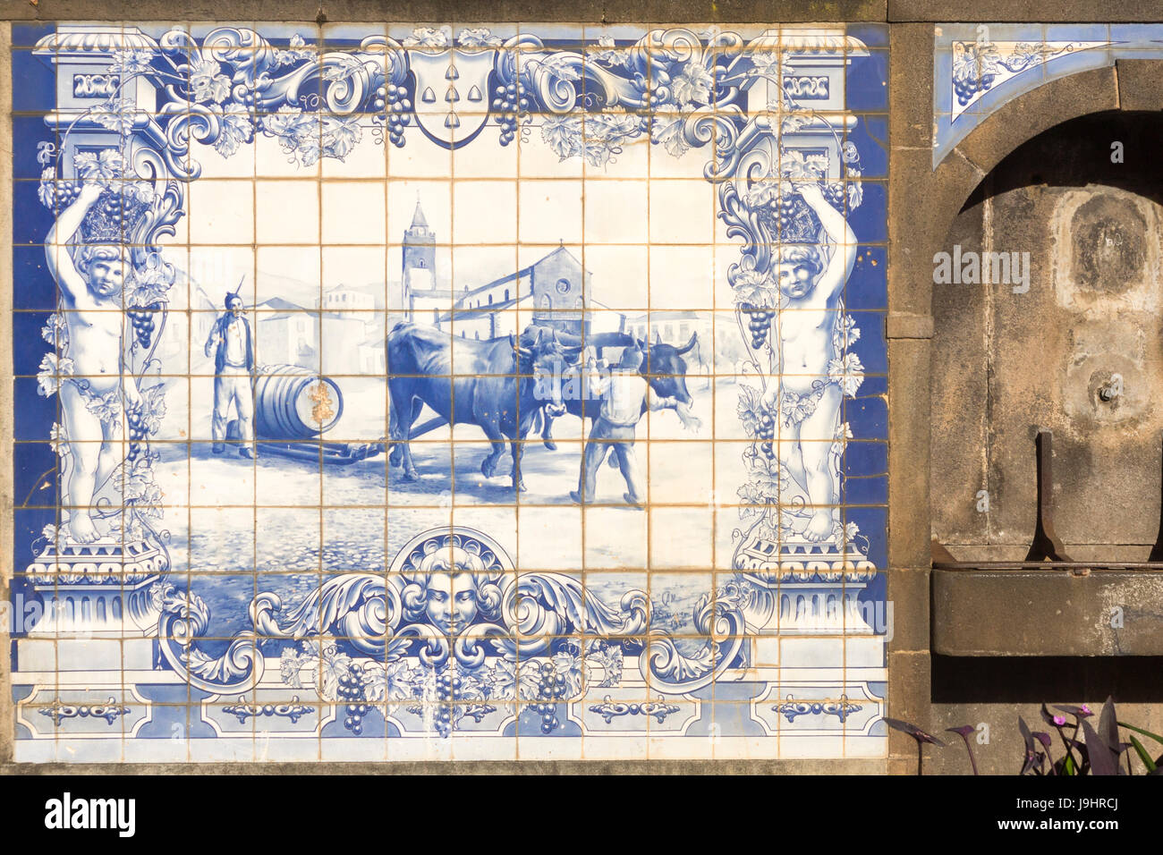 Traditional Portugese blue and white Azulejo tiling showing farming scenes in Funchal, Madeira Stock Photo