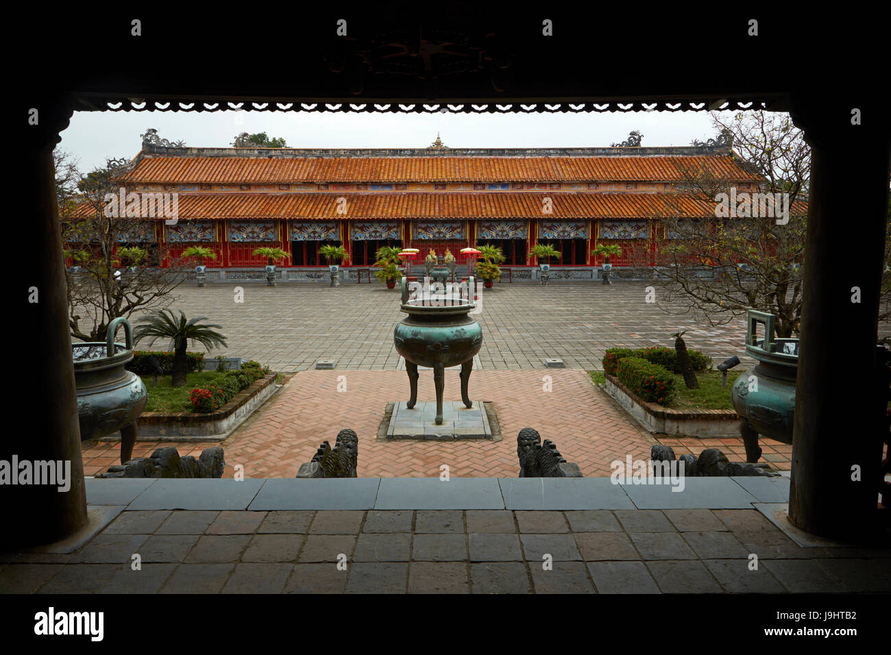 One of Nine Dynastic Urns (1835/36), and To Mieu Temple, seen from Hien Lam Pavillion, historic Hue Citadel (Imperial City), Hue, North Central Coast, Stock Photo