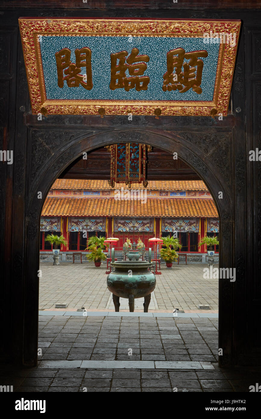 One of Nine Dynastic Urns (1835/36), and To Mieu Temple, seen from Hien Lam Pavillion, historic Hue Citadel (Imperial City), Hue, North Central Coast, Stock Photo