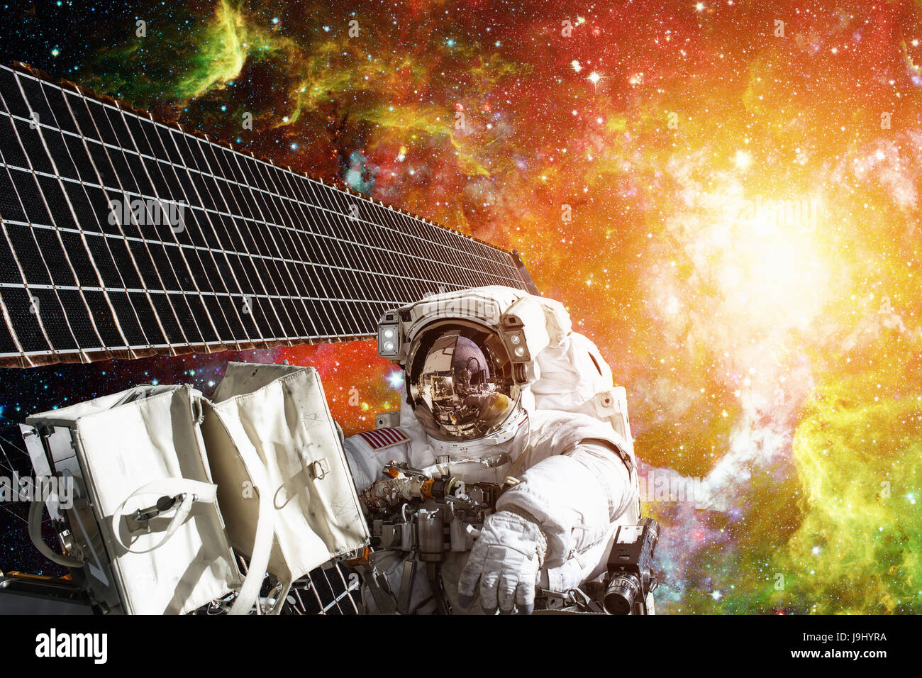 Astronaut on space mission. Elements of this image furnished by NASA. Stock Photo