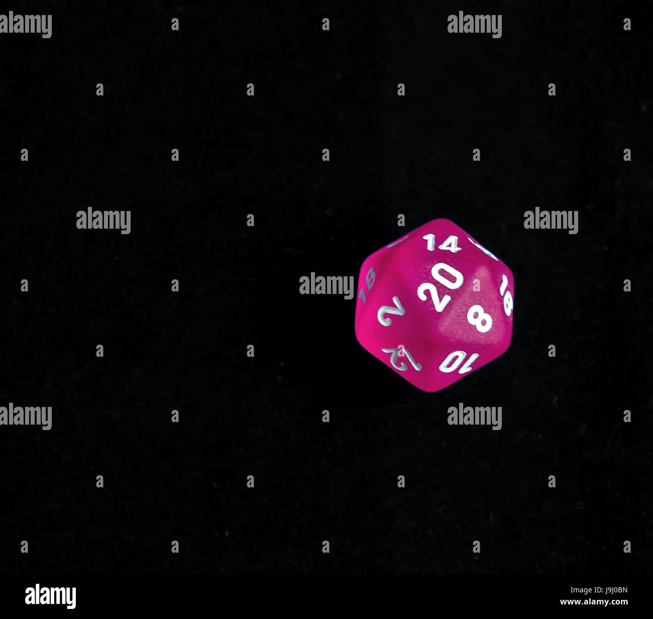 Pink d20 critical success roll RPG polyhedral game dice Stock Photo