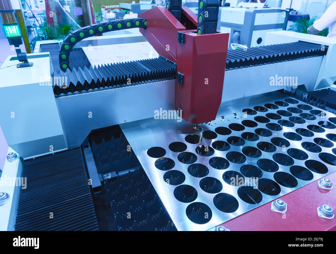 CNC laser cut machine while cutting the sheet metal Stock Photo - Alamy
