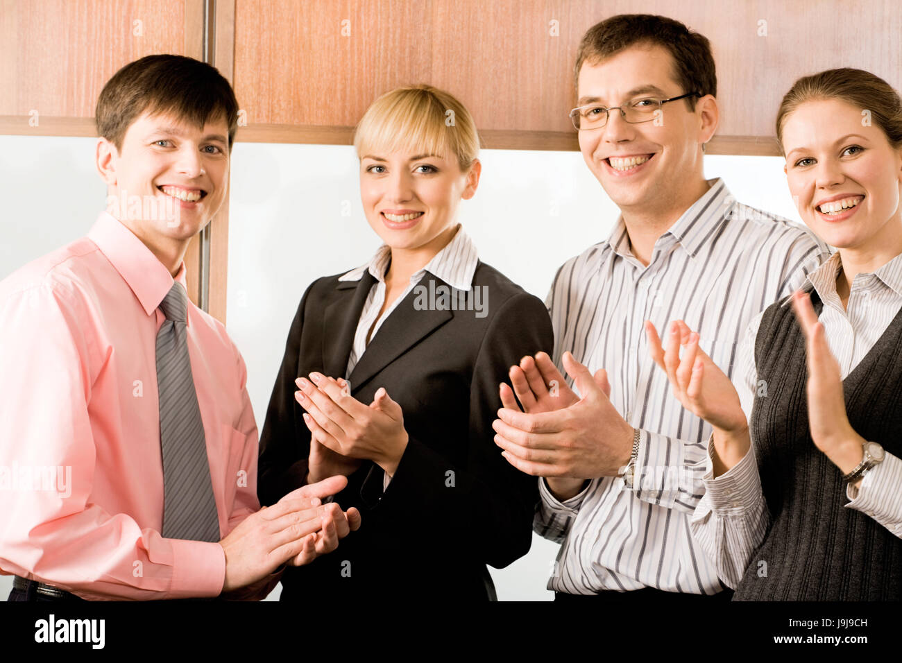 Positive man woman workers clap hi-res stock photography and images - Alamy