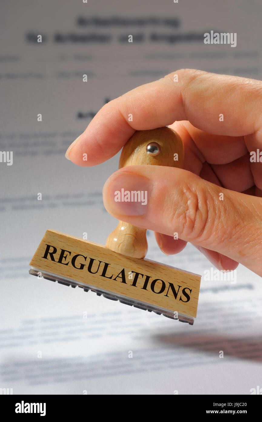 regulations marked on rubber stamp over document Stock Photo Alamy