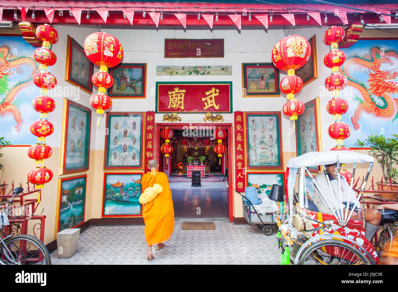 Thailand, Chiang Mai, Chinatown, Monk Entering Small Chinese Temple Stock Photo